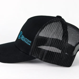side view of a black mesh back hat with a solutions staffing logo